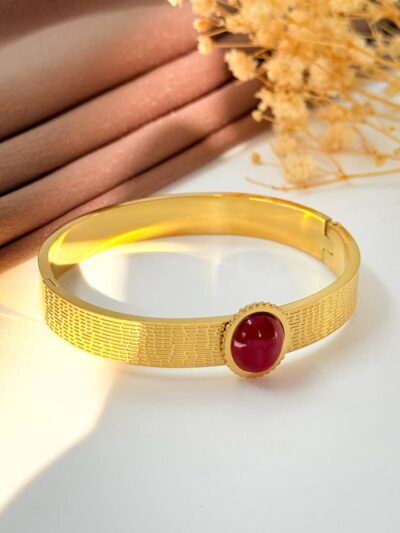 Eye twist red gold plated bangle