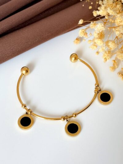 Black roman gold plated bangle
