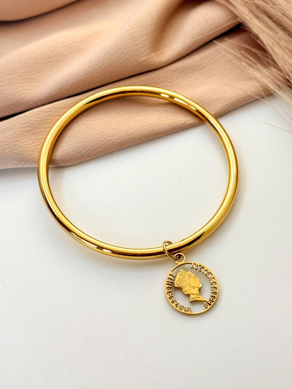Queen gold plated bangle
