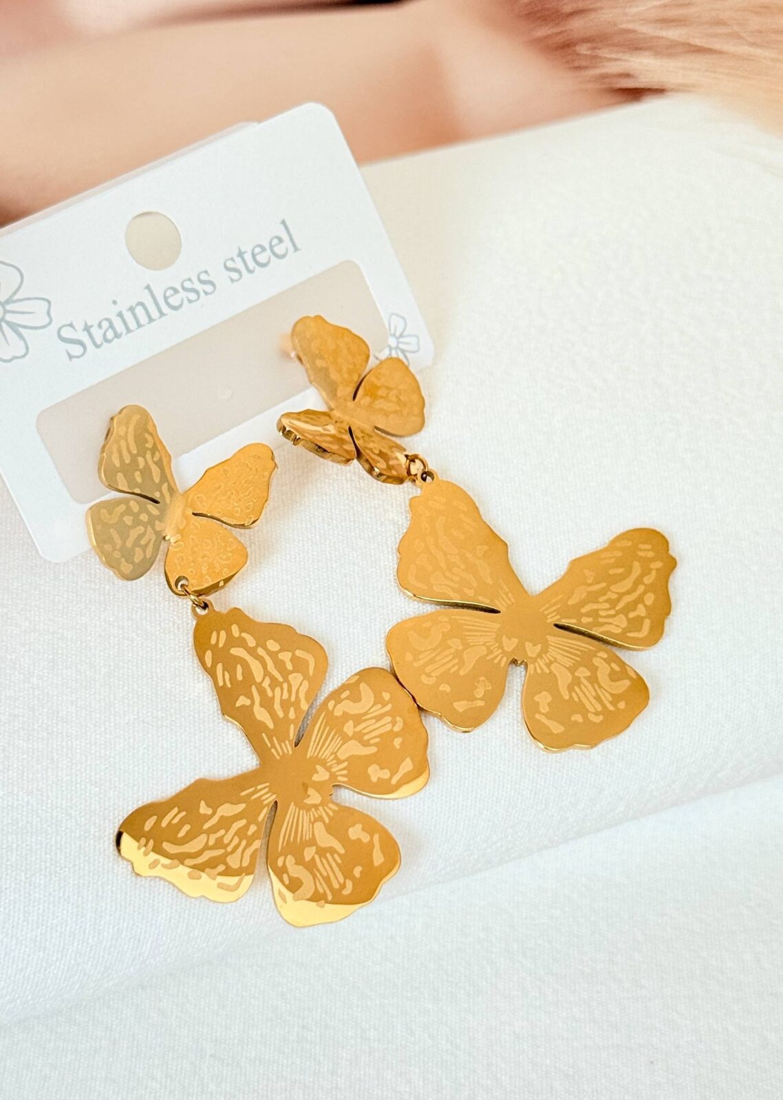 Long butterfly gold-plated earrings